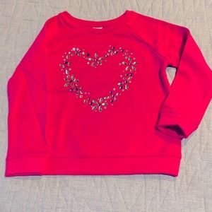 Girls pink sweater with a bejeweled heart.  Size 5-6